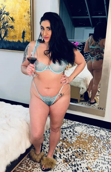 A glass of wine, some see through lingerie & fuzzy slippers 