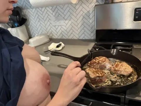 Cooking both of them a steak before we all play